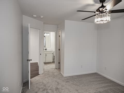 Primary bedroom at 12517 Timber Creek Drive, Carmel, IN — Spacious primary suite with ensuite bath and closet access.