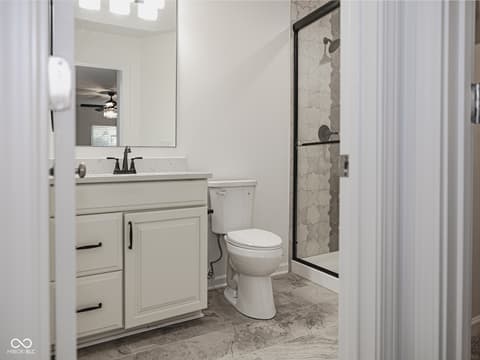 Primary bathroom at 12517 Timber Creek Drive, Carmel, IN — Modern renovated primary bath with spacious walk-in shower.