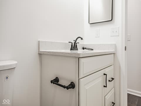 Primary bathroom at 12517 Timber Creek Drive, Carmel, IN — Clean, updated bathroom with elegant quartz countertops.