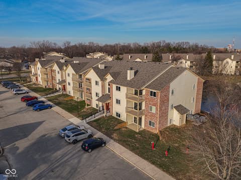 Aerial view at 12517 Timber Creek Drive, Carmel, IN — Well-maintained multi-unit complex with excellent parking.
