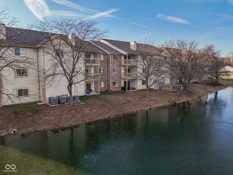 Backyard at 12517 Timber Creek Drive, Carmel, IN — Waterfront multi-unit property with direct water access.