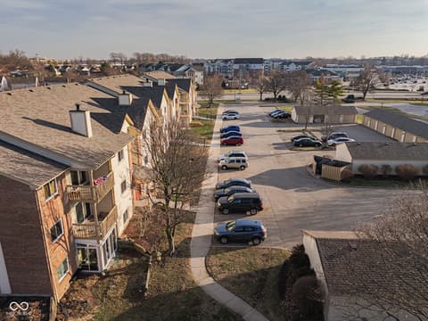 Aerial view at 12517 Timber Creek Drive, Carmel, IN — Aerial view of established community with brick homes.