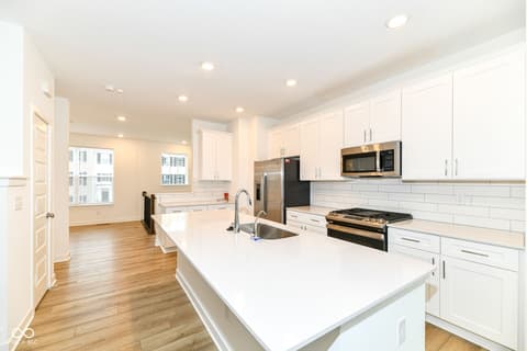 Kitchen at 6959 Equality Boulevard, Carmel, IN — Bright, renovated kitchen with premium finishes and island.