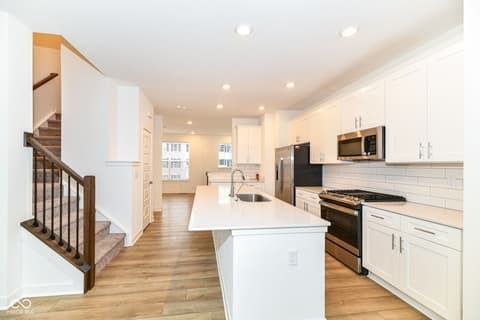 Kitchen at 6959 Equality Boulevard, Carmel, IN — Bright modern kitchen with island and open layout.