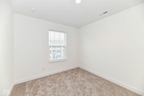 Bedroom at 6959 Equality Boulevard, Carmel, IN — Bright, spacious bedroom with fresh modern finishes.