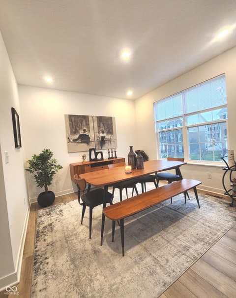 Dining room at 6959 Equality Boulevard, Carmel, IN — Bright modern dining room with abundant natural light.