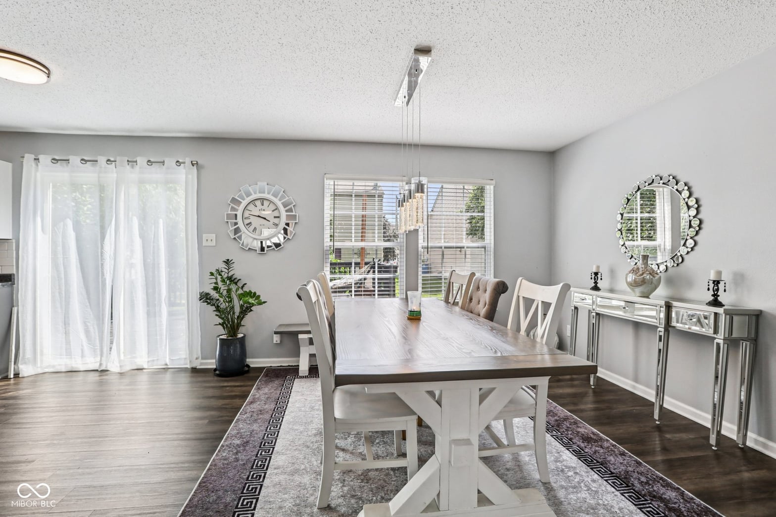 Bright, updated farmhouse dining with patio access and modern finishes.