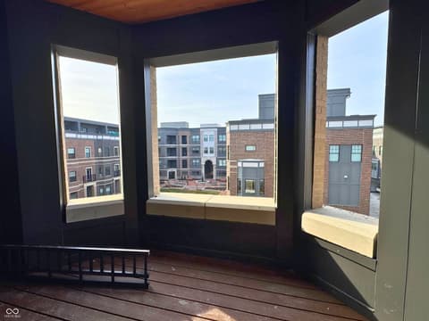 Outdoor living area at 925 Veterans Way, Carmel, IN — Modern urban balcony with expansive city views.