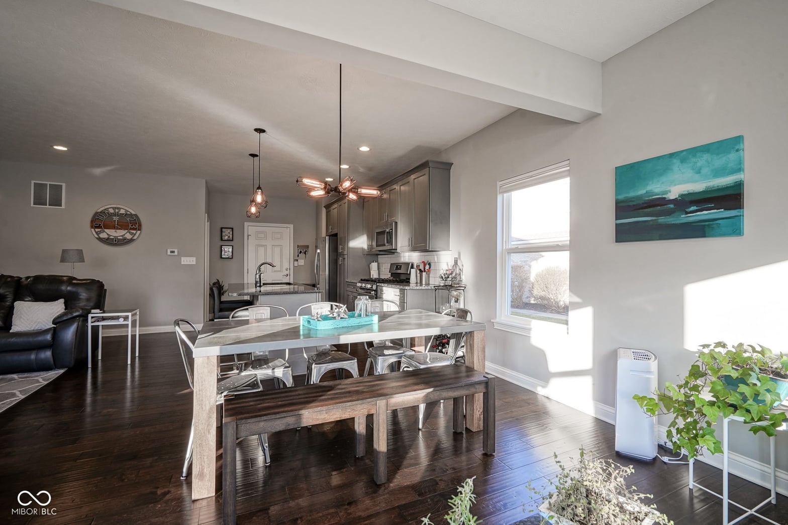 Modern open-concept kitchen with island and ample natural light.