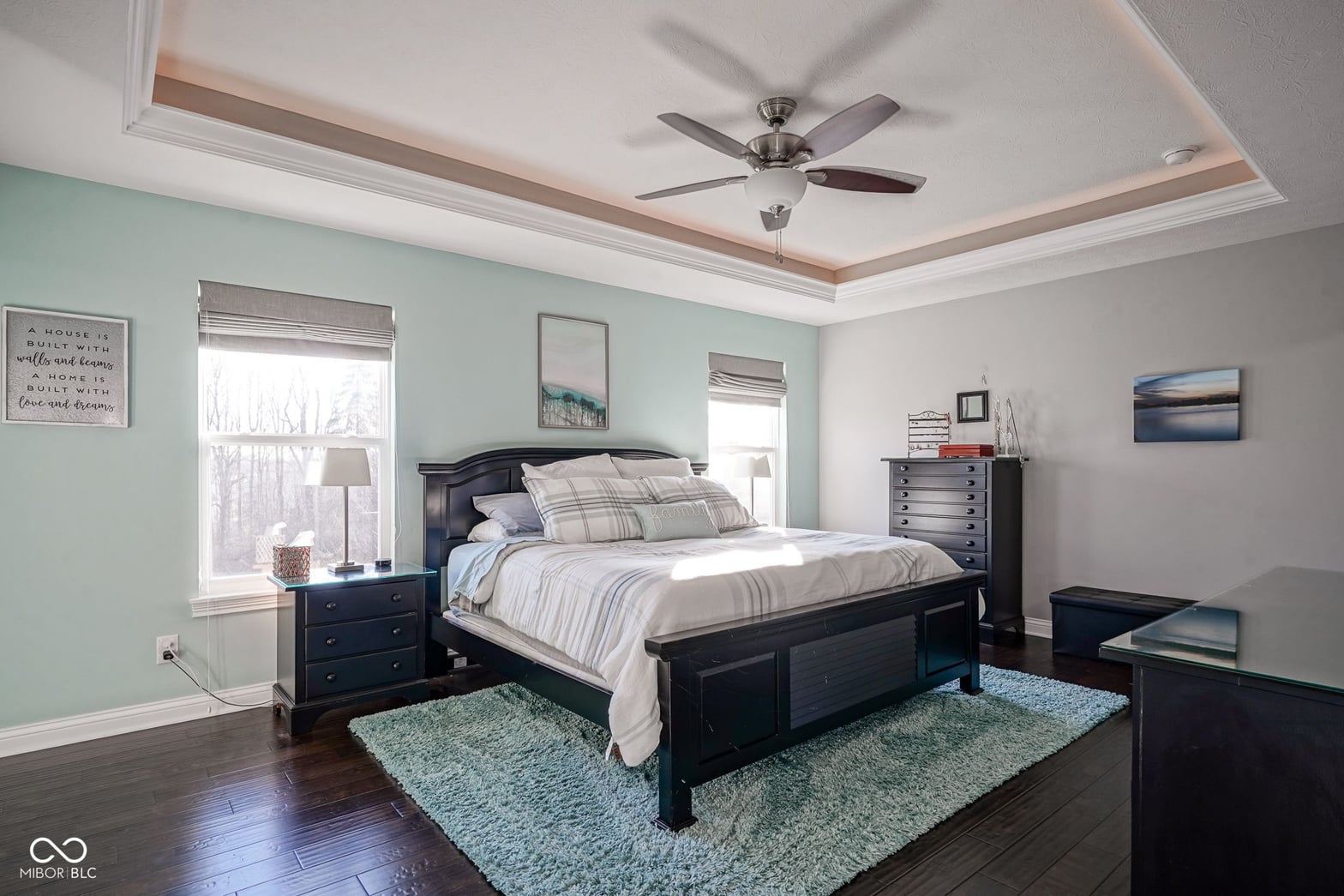 Bright primary suite with tray ceiling and updated finishes.