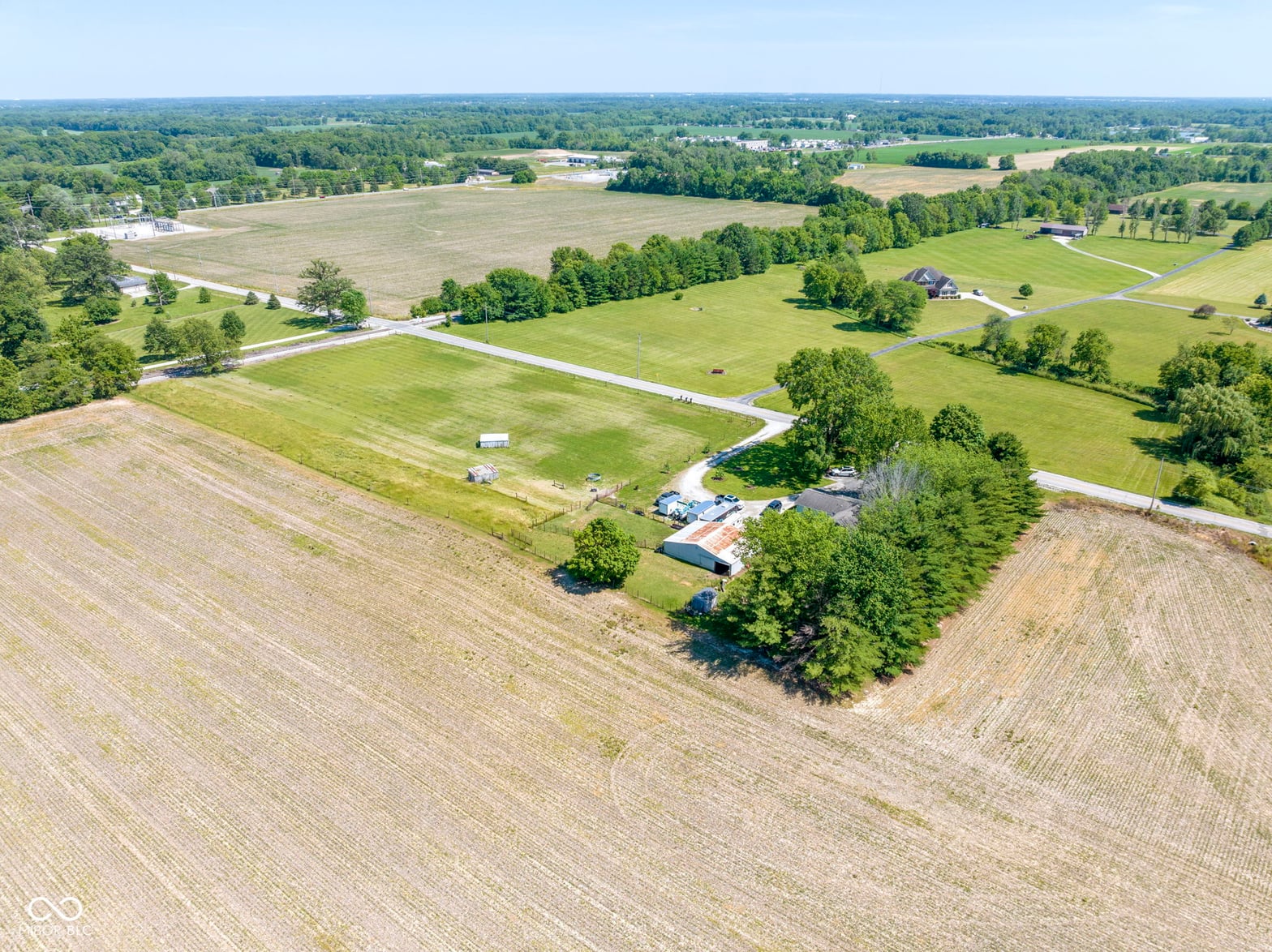 Aerial view at 8440 E 216th Street, Cicero, IN — Sprawling rural estate with productive agricultural acreage.