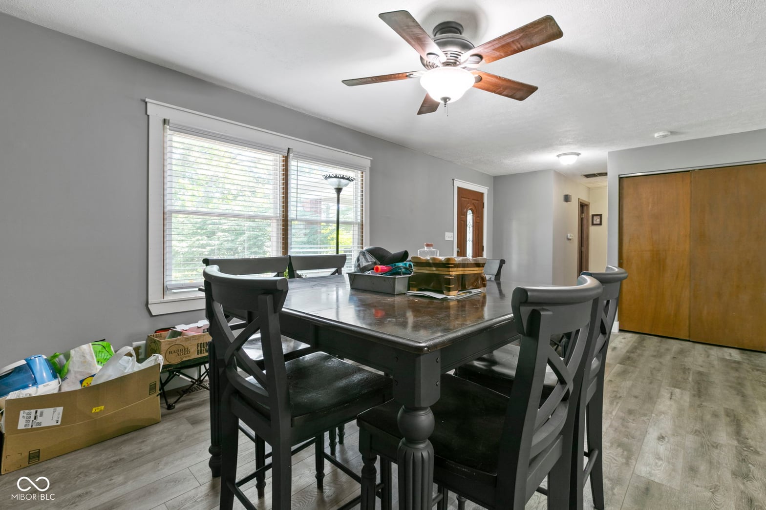 Dining room at 8440 E 216th Street, Cicero, IN — Bright dining area with large windows and ceiling fan.