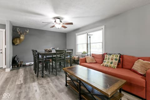 Family room at 8440 E 216th Street, Cicero, IN — Open-concept living with dining area and natural light.
