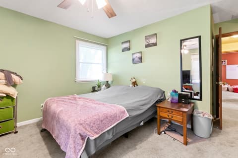 Bedroom at 8440 E 216th Street, Cicero, IN — Bright bedroom with large window and fresh paint.