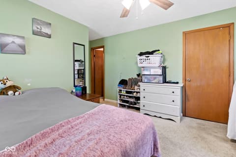 Bedroom at 8440 E 216th Street, Cicero, IN — Spacious bedroom with ample storage and natural light.