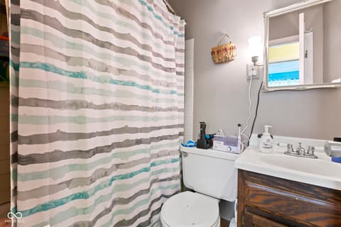 Bathroom at 8440 E 216th Street, Cicero, IN — Functional bathroom with wood vanity and natural lighting.