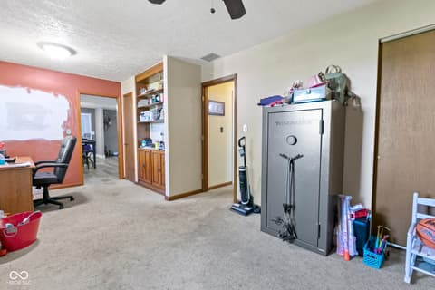 Bonus room at 8440 E 216th Street, Cicero, IN — Versatile bonus room with built-ins and ample storage.