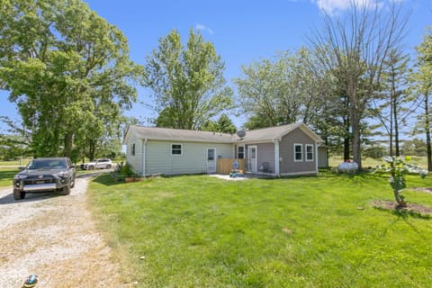 Front exterior at 8440 E 216th Street, Cicero, IN — Charming ranch home on spacious landscaped property.