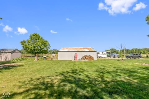 Backyard at 8440 E 216th Street, Cicero, IN — Spacious rural property with barn and extensive grounds.