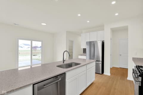 Kitchen at 3932 E 191st Street, Westfield, IN — Bright modern kitchen with island and outdoor views.