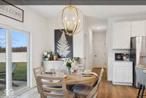 Dining room at 3932 E 191st Street, Westfield, IN — Bright modern dining with views to manicured yard.