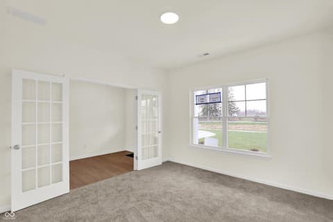 Primary bedroom at 3932 E 191st Street, Westfield, IN — Bright bedroom with large windows and modern finishes.