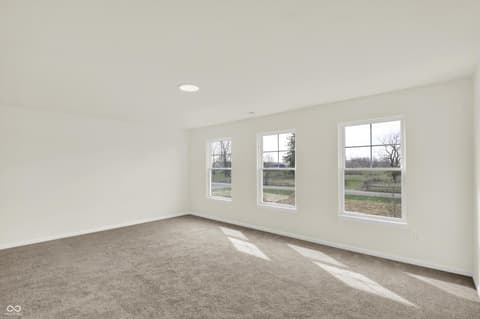 Bedroom at 3932 E 191st Street, Westfield, IN — Bright bedroom with expansive windows and countryside views.