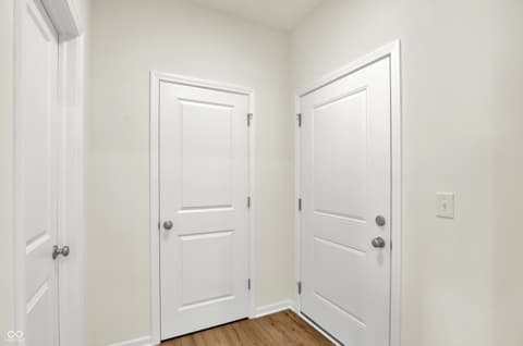 Hallway at 3932 E 191st Street, Westfield, IN — Bright hallway with hardwood floors and multiple closets.
