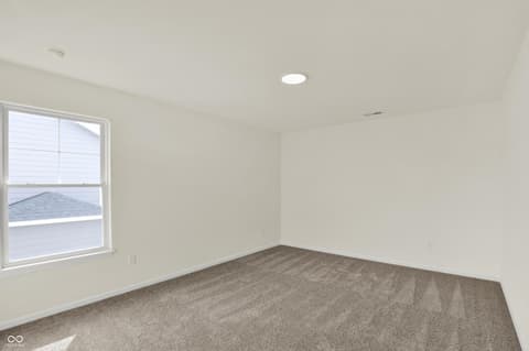 Bedroom at 3932 E 191st Street, Westfield, IN — Bright new bedroom with large windows and neutral finishes.