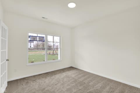 Bedroom at 3932 E 191st Street, Westfield, IN — Bright bedroom with large windows and neutral finishes.