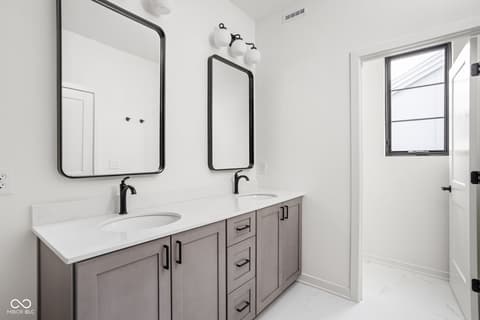 Primary bathroom at 1678 Coach Drive, Westfield, IN — Luxurious primary bath with dual vanity and modern finishes.