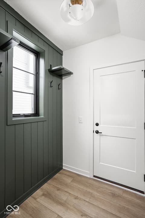 Foyer at 1678 Coach Drive, Westfield, IN — Bright modern entryway with shiplap accent wall.