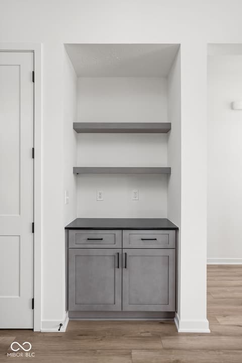 Bonus room at 1678 Coach Drive, Westfield, IN — Custom built-in shelving and storage with modern finishes.