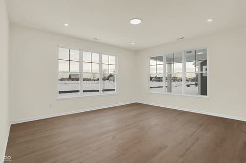 Living room at 19785 Highclere Lane, Sheridan, IN — Bright modern living space with abundant natural light.