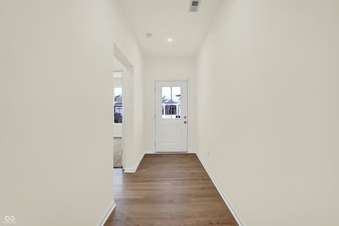 Foyer at 19785 Highclere Lane, Sheridan, IN — Bright, modern foyer with hardwood floors and natural light.