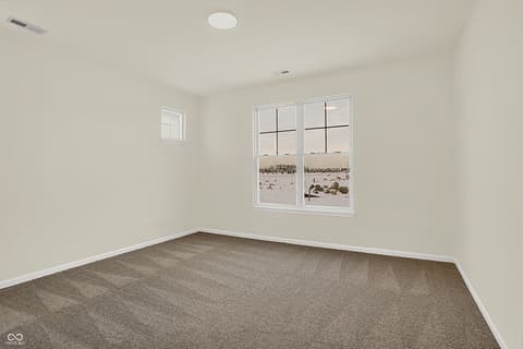 Bedroom at 19785 Highclere Lane, Sheridan, IN — Bright bedroom with ocean views and modern finishes.