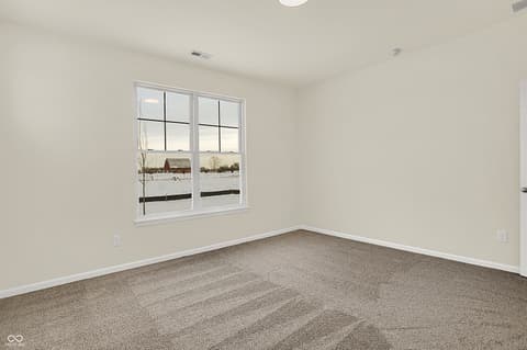 Bedroom at 19785 Highclere Lane, Sheridan, IN — Bright bedroom with large windows and new carpet.