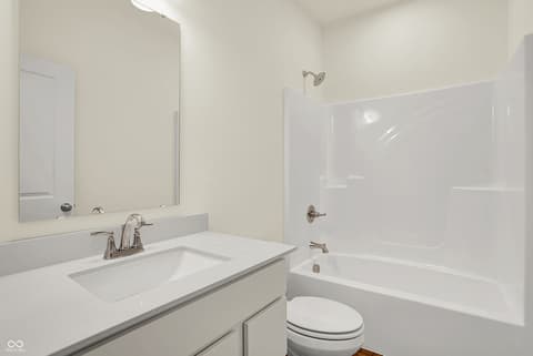 Primary bathroom at 19785 Highclere Lane, Sheridan, IN — Clean, bright primary bathroom with modern white finishes.