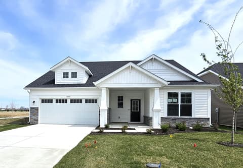 Front exterior at 19785 Highclere Lane, Sheridan, IN — Charming new construction farmhouse with modern amenities.