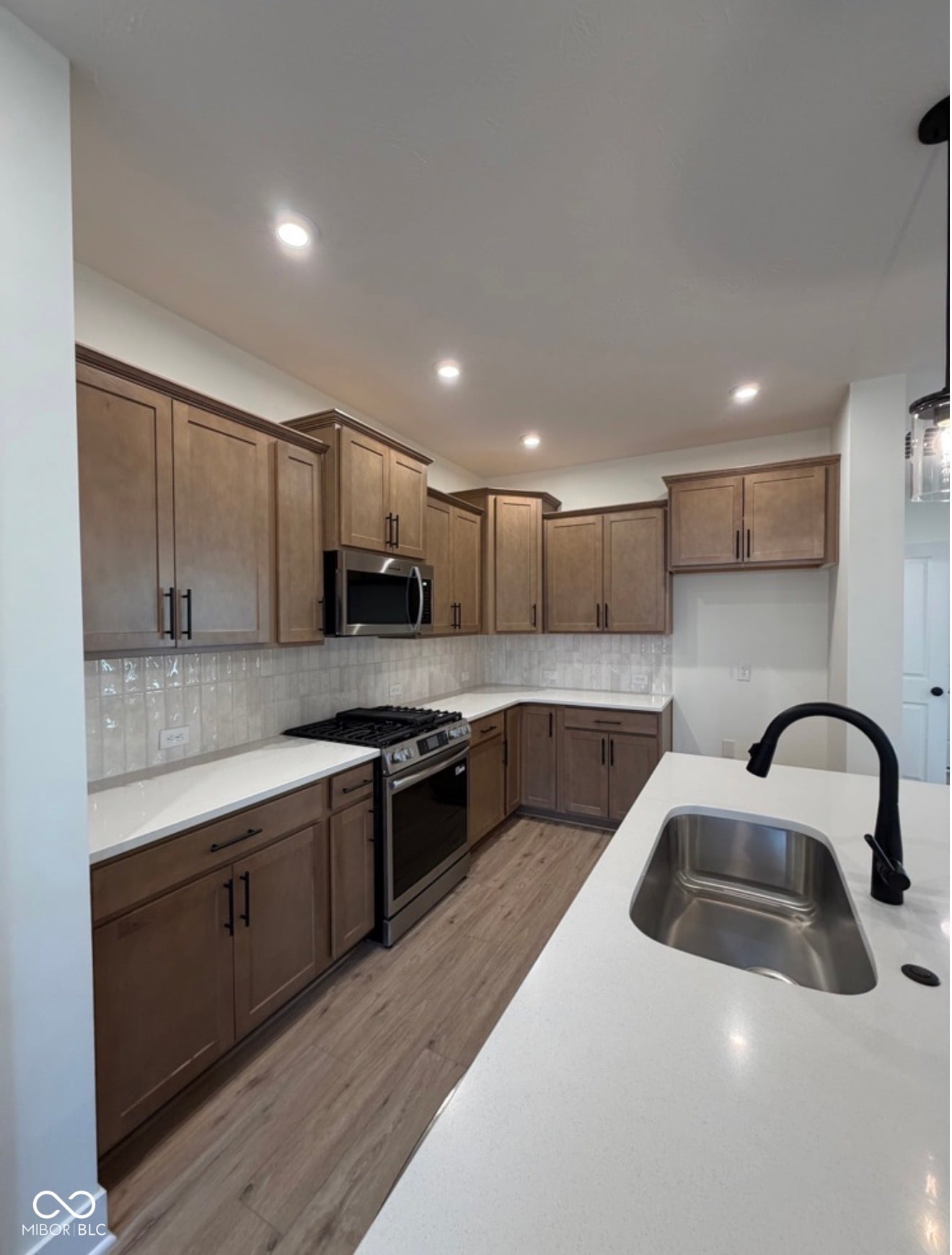 Newly renovated kitchen with quality finishes and modern appliances.