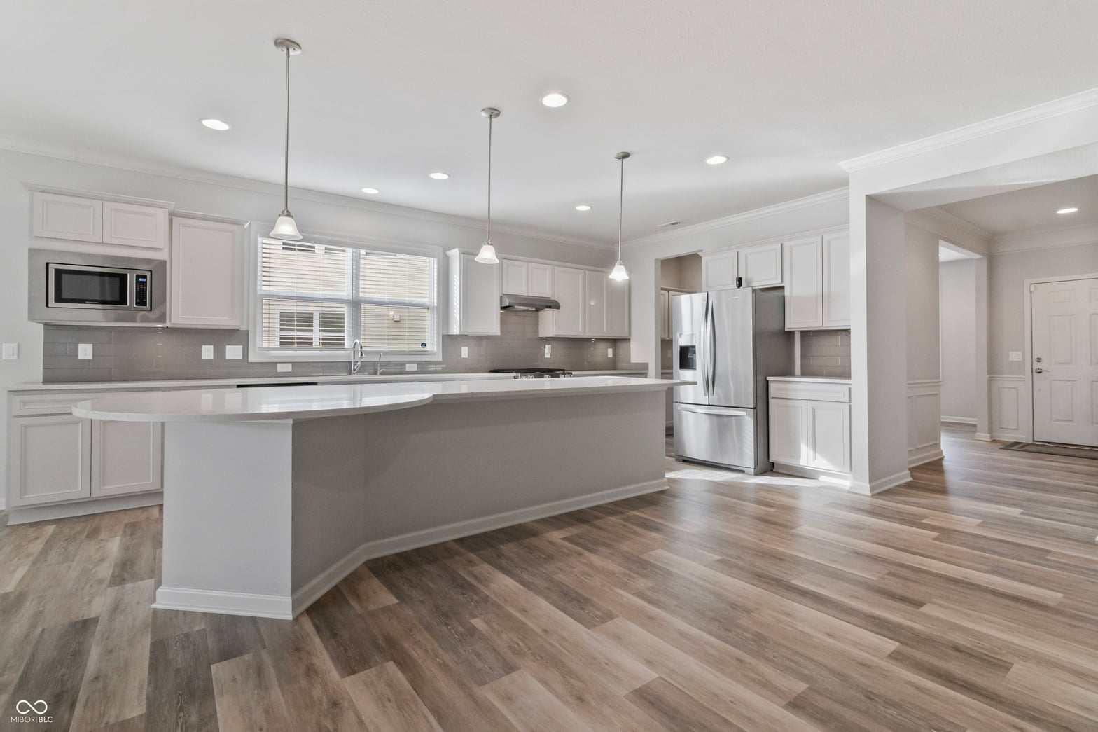 Bright modern kitchen with large island and premium finishes.