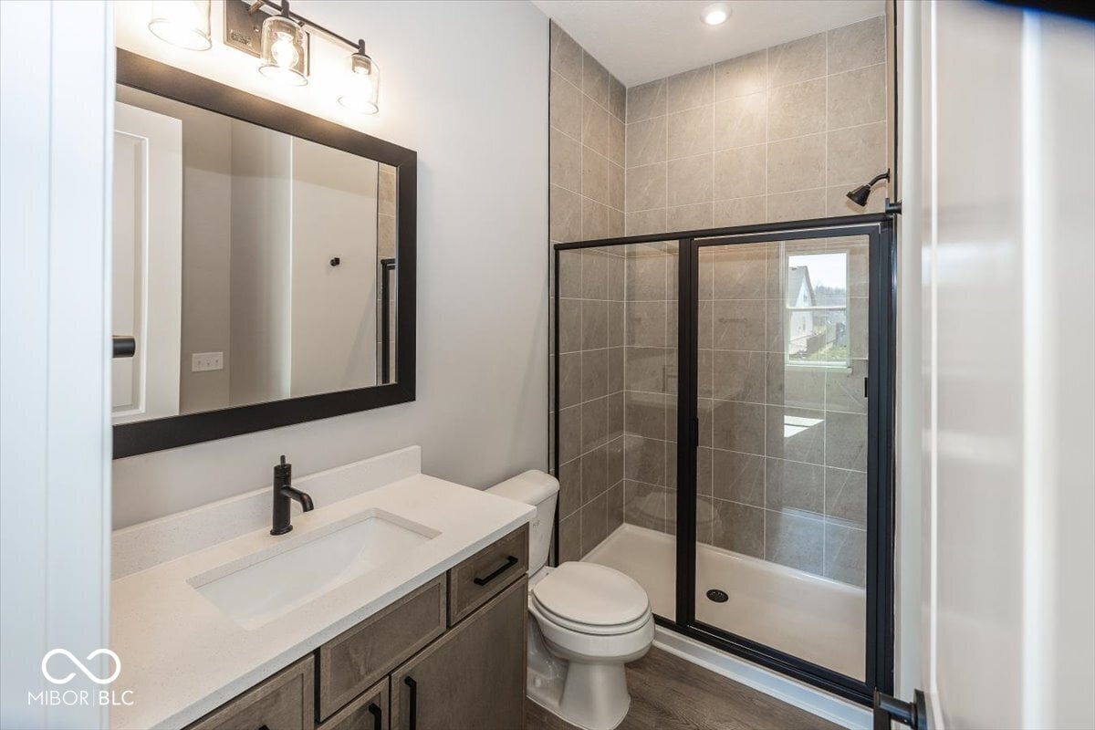 Modern primary bath with elegant finishes and large shower.