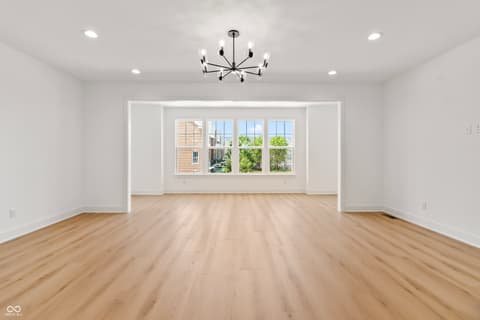 Living room at 15407 Mystic Rock Drive, Carmel, IN — Bright, spacious living area with abundant natural light.