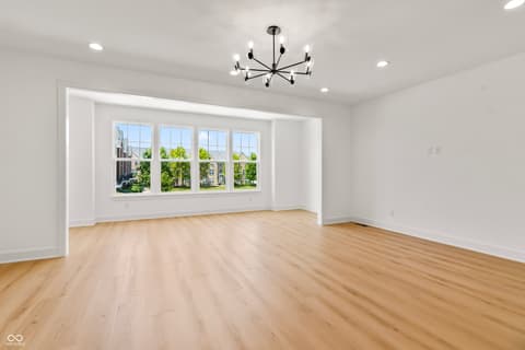 Living room at 15407 Mystic Rock Drive, Carmel, IN — Bright, open living space with abundant natural light.