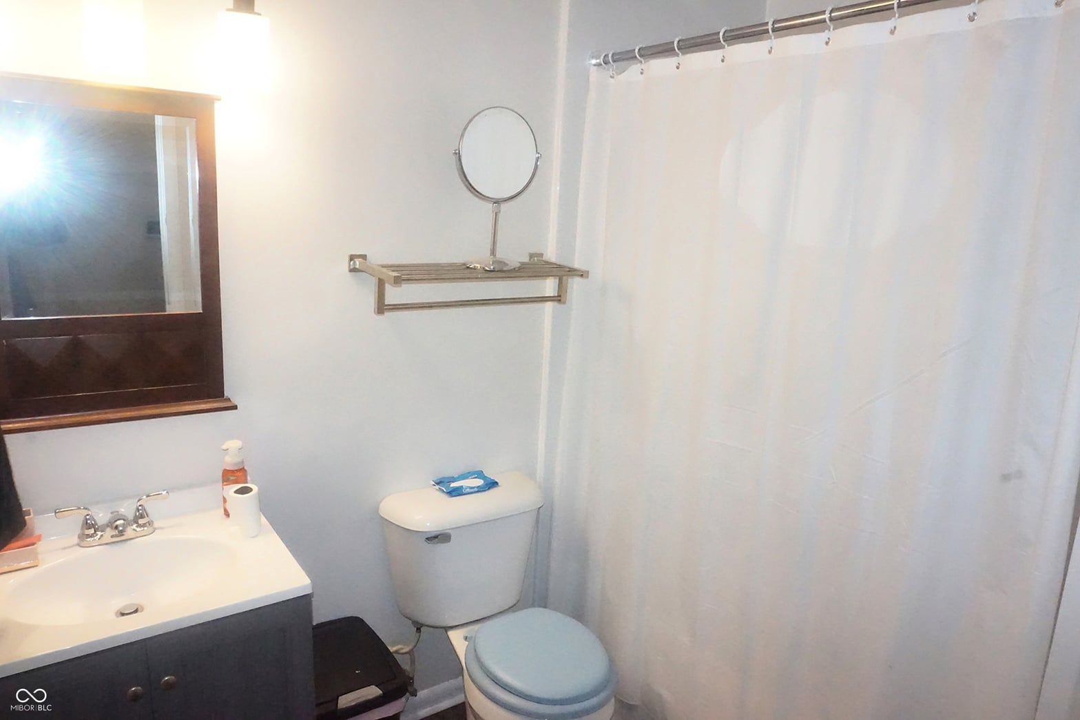 Clean, bright bathroom with modern fixtures and storage.