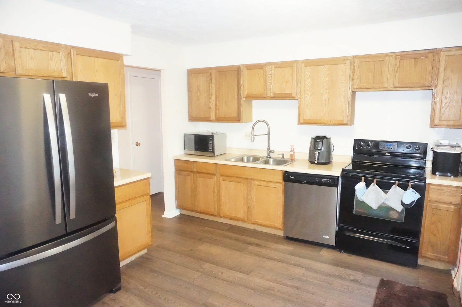 Spacious kitchen with ample cabinetry and stainless steel appliances.