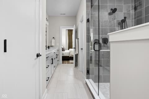 Primary bathroom at 11373 Nickel Row, Fishers, IN — Luxurious primary bath with walk-in shower and dual vanity.