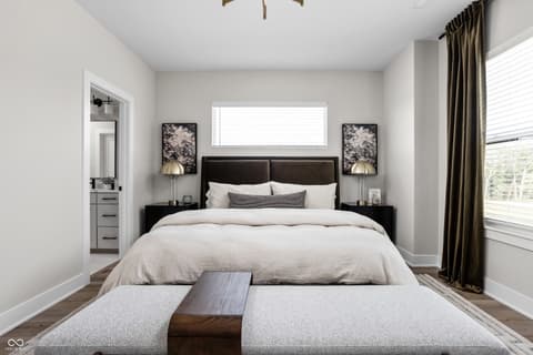 Primary bedroom at 11373 Nickel Row, Fishers, IN — Luxurious primary suite with spa-like ensuite bathroom.