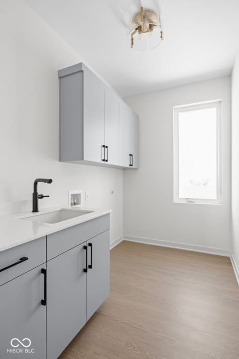 Laundry room at 1471 Whistle Way, Westfield, IN — Bright, modern laundry room with ample storage and finishes.