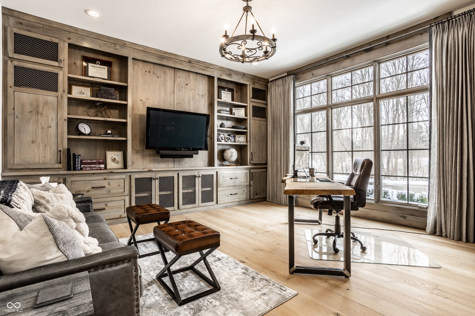 Luxurious multi-purpose family room with custom built-ins.